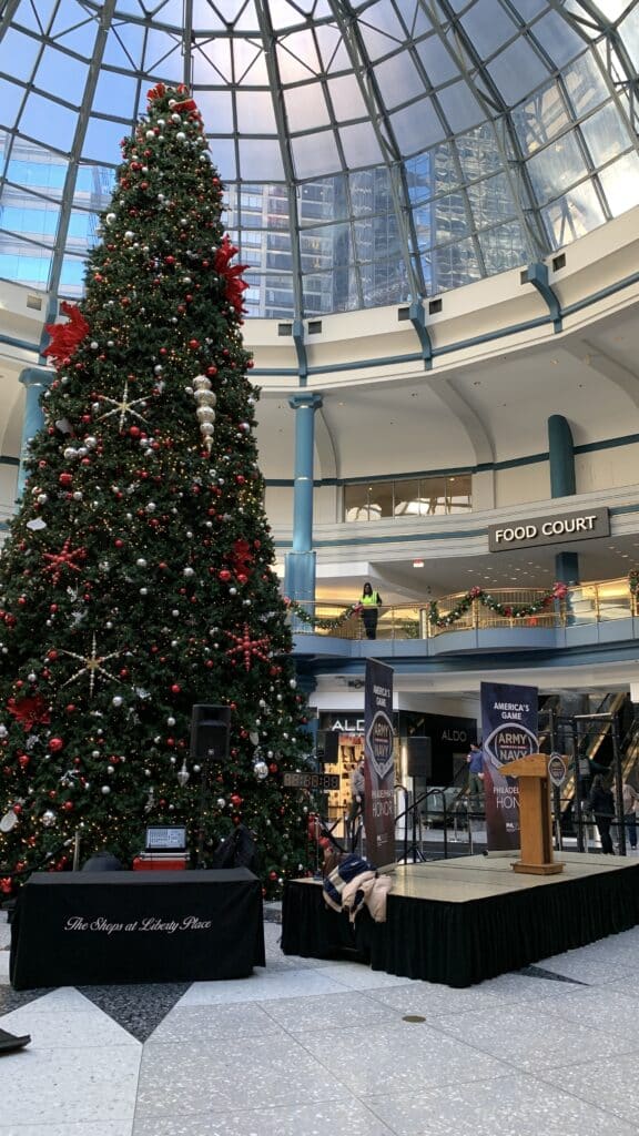 projection, screen, audio visual, ballroom, pep rally, army navy game, army, navy, podium, shops at liberty, liberty place, christmas tree, huge tree, huge xmas tree, big christmas tree, christmas, tree